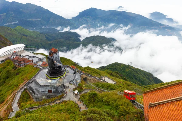 View of the Buddha statue and the funicular tram from the Fansip — Stock Photo, Image