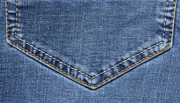 Текстура синих джинсов крупным планом — стоковое фото