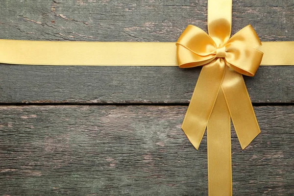 Golden Bow Ribbon Wooden Table — Stock Photo, Image