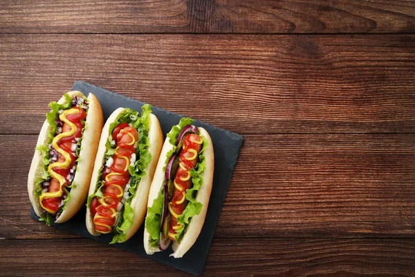 Hot Dogs Ketchup Mustard Vegetables Wooden Table — Stock Photo, Image