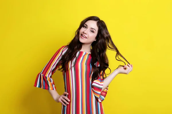 Young Woman Striped Dress Yellow Background — Stock Photo, Image