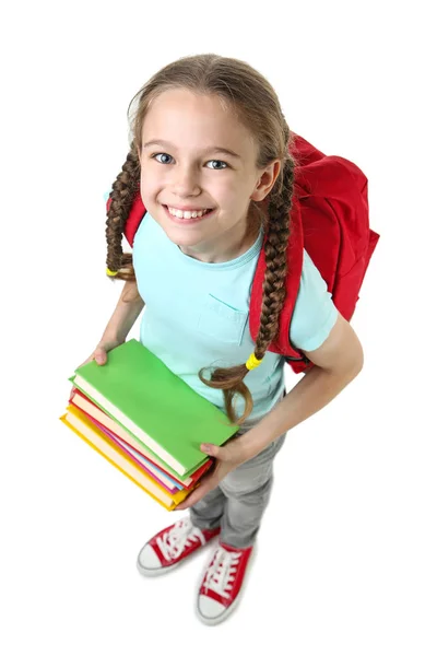 Junges Mädchen Mit Rucksack Und Büchern Auf Weißem Hintergrund — Stockfoto