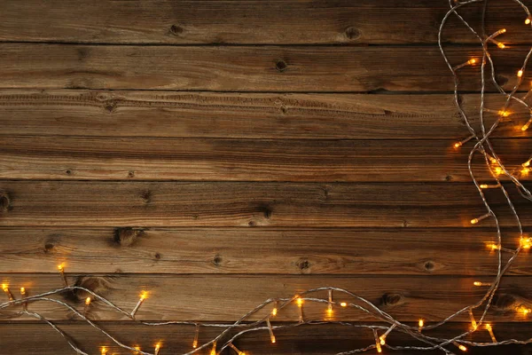 Christmas Garland Lights Brown Wooden Table — Stock Photo, Image