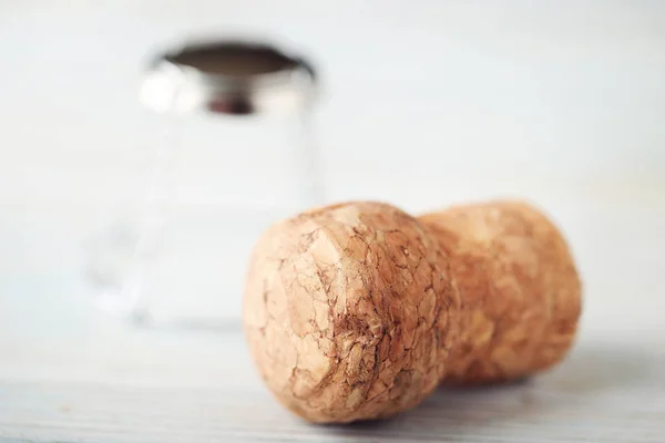 Champagne corks on wooden table