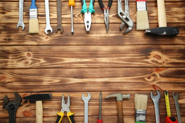 Verschiedene Werkzeuge Auf Braunem Holztisch — Stockfoto