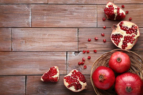 Ripe Juicy Pomegranates Grey Wooden Table — Stock Photo, Image