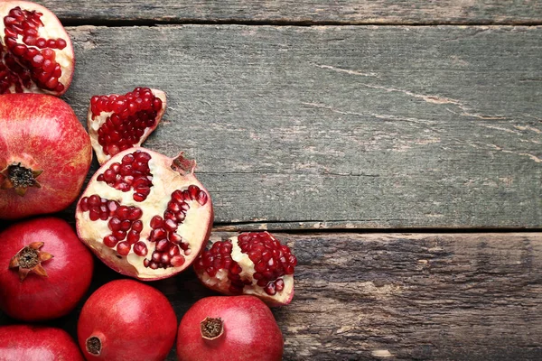 Ripe Juicy Pomegranates Grey Wooden Table — Stock Photo, Image
