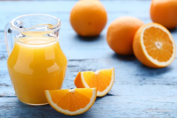 Orange Fruits Jug Juice Blue Wooden Table — Stock Photo, Image