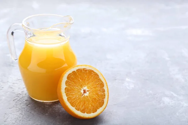 Half Orange Fruit Jug Juice Grey Wooden Table — Stock Photo, Image