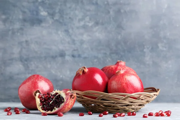 Ripe Juicy Pomegranates Basket Wooden Table — Stock Photo, Image