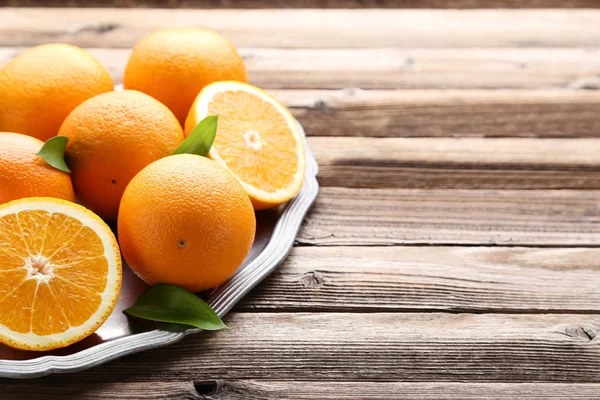 Orange Fruits Green Leaves Tray Brown Wooden Table — Stock Photo, Image