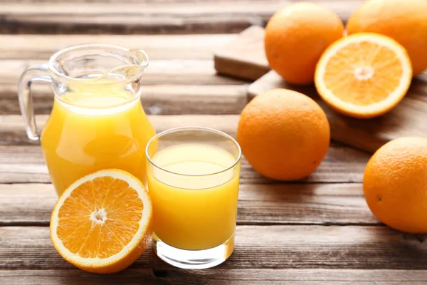 Orange Fruits Jug Glass Juice Brown Wooden Table — Stock Photo, Image