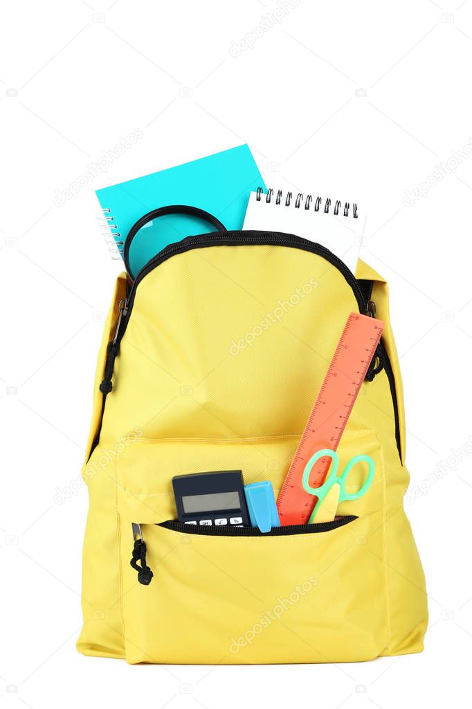 Yellow backpack with school supplies isolated on white background