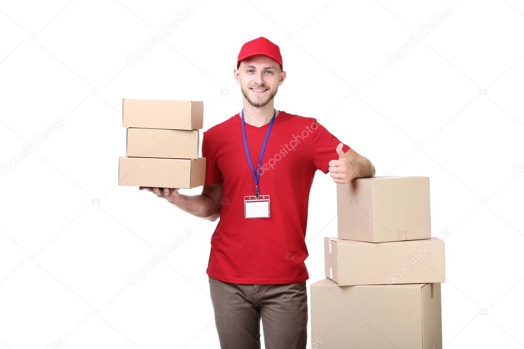Delivery man with cardboard boxes on white background