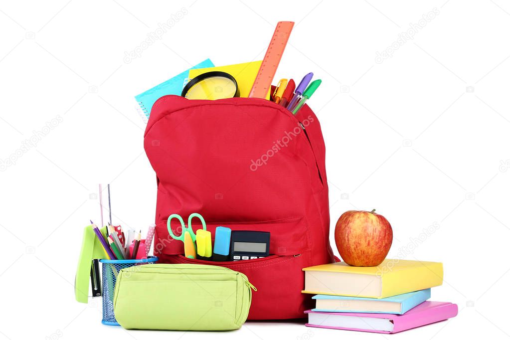 Red backpack with school supplies on white background