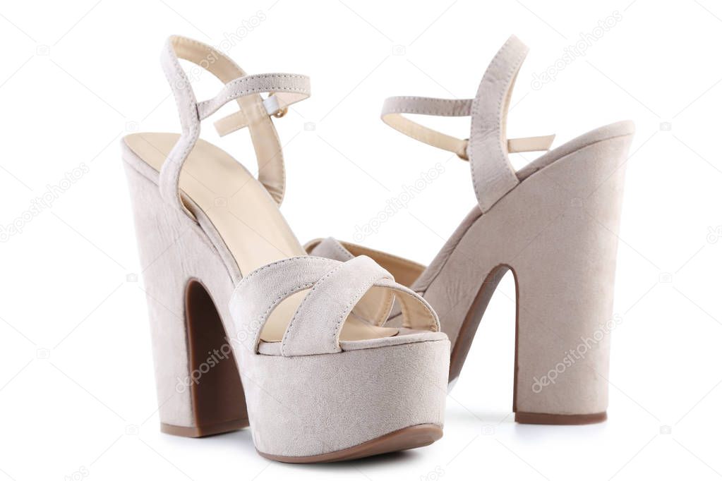 Beige high heel shoes isolated on white background