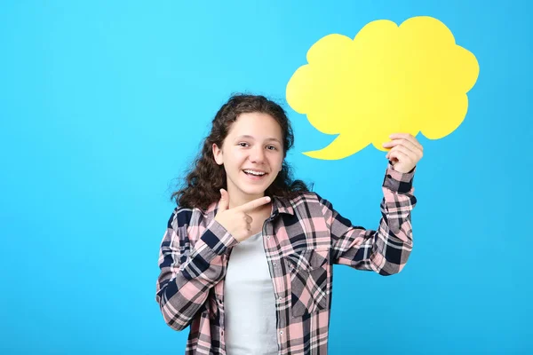 Young Girl Holding Speech Bubble Pointing Finger Aside Blue Background — Stock Photo, Image