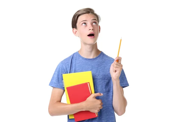 Nachdenklicher Junge Mit Büchern Und Spitzem Bleistift Auf Weißem Hintergrund — Stockfoto