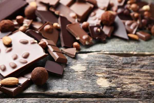 Chocolate Pieces Nuts Wooden Table — Stock Photo, Image