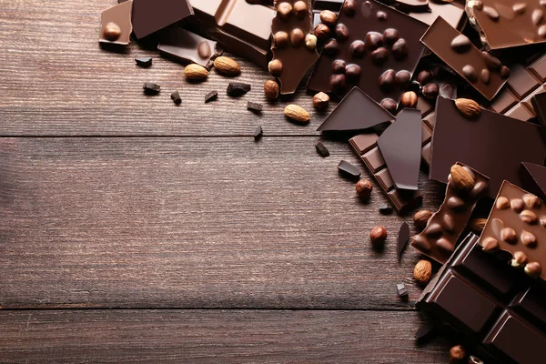 Chocolate Pieces Nuts Brown Wooden Table — Stock Photo, Image