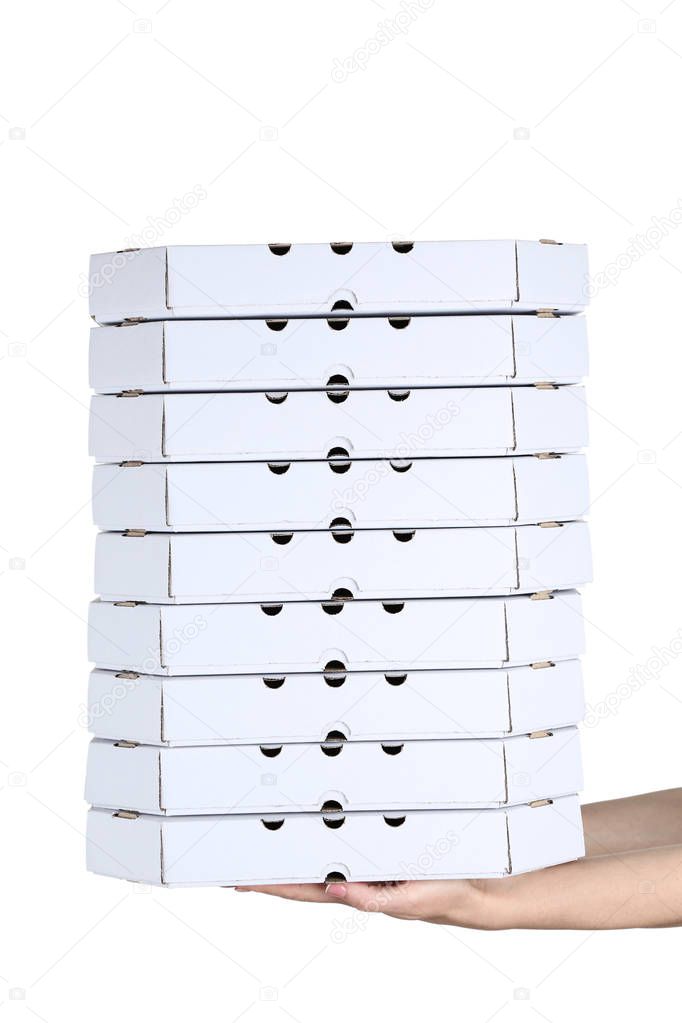 Female hands holding pizza boxes on white background