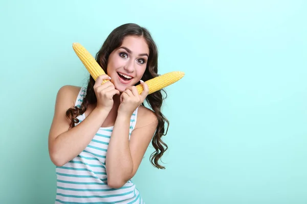 Young woman with corns on mint background