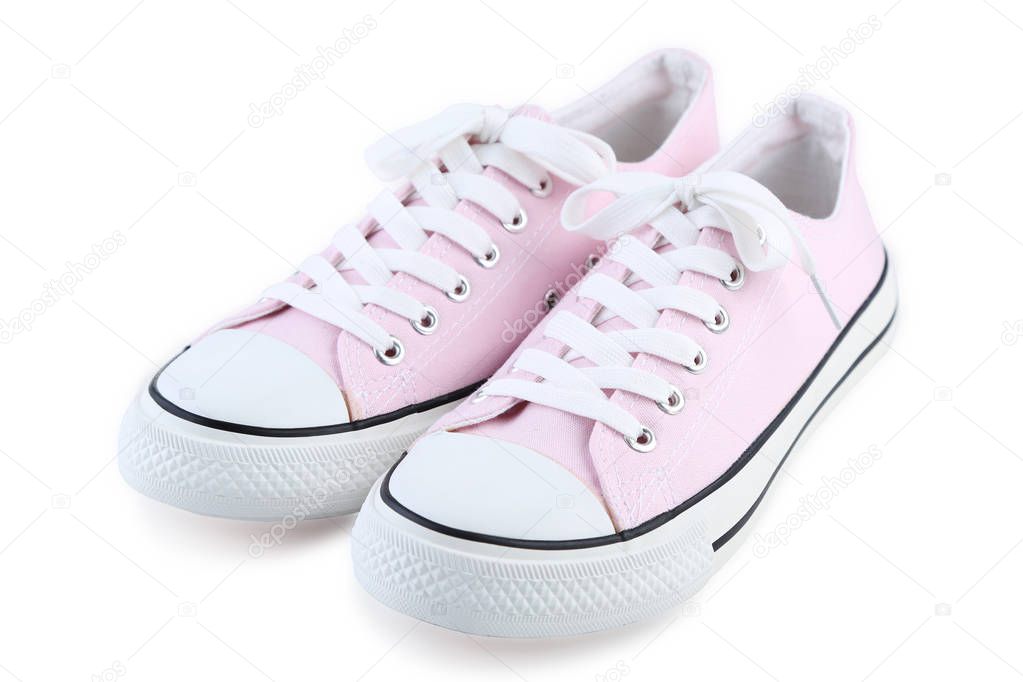 Pair of pink sneakers isolated on white background