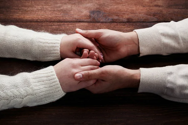 Female Male Holding Hands Brown Wooden Background — Stock Photo, Image