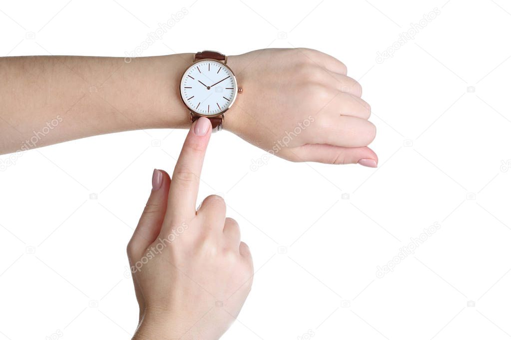Elegant wrist watch on human hand on white background