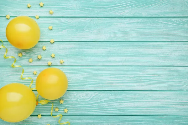 Yellow Balloons Paper Stars Mint Wooden Background — Stock Photo, Image