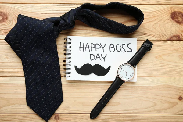 Надпись Happy Boss Day Notebook Wrist Watch Tie Wooden Surface — стоковое фото