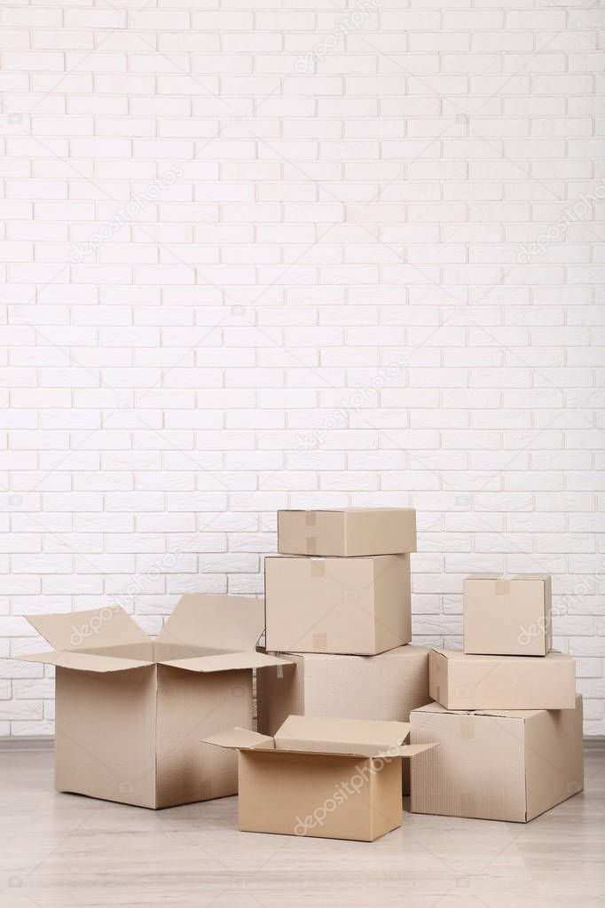 cardboard boxes on brick wall background