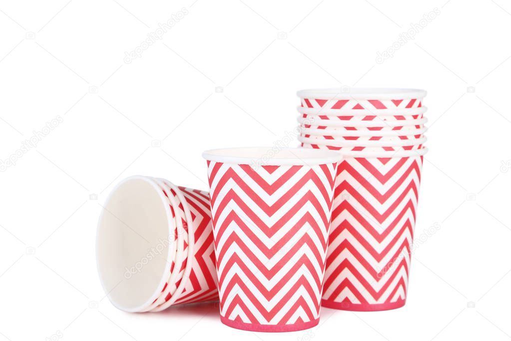 Red patterned paper cups on white background