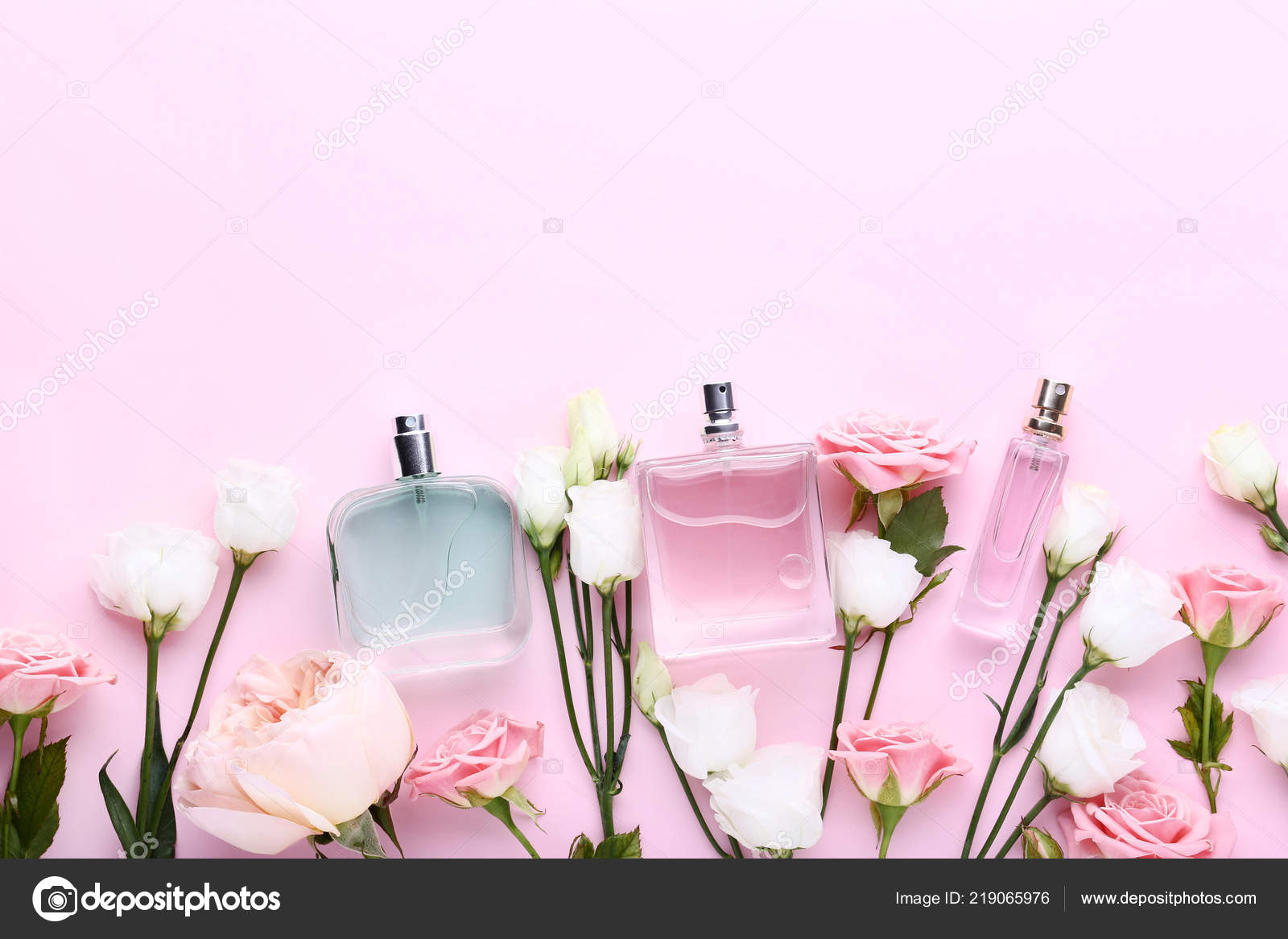 Perfume Bottles Flowers Pink Background — Stock Photo © 5seconds 219065976
