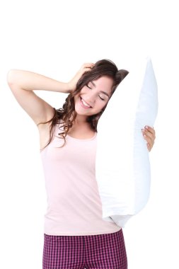 Güzel kız beyaz arka plan üzerinde izole yastık holding