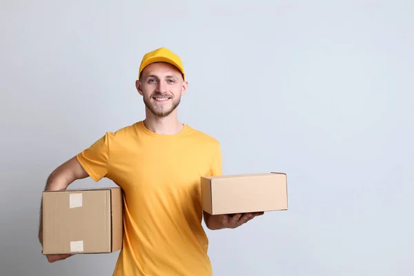 Delivery Man Cardboard Boxes Grey Background — Stock Photo, Image