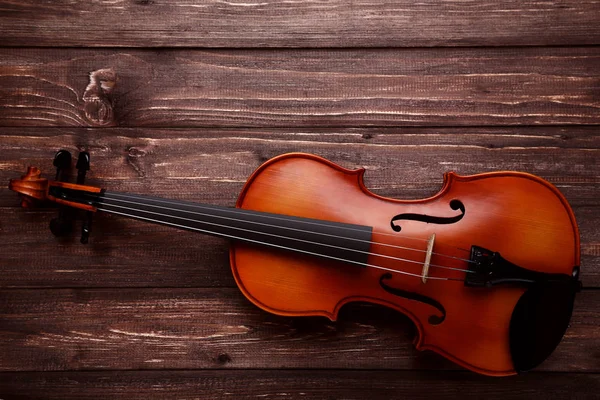 Violininstrument Auf Braunem Holzgrund — Stockfoto