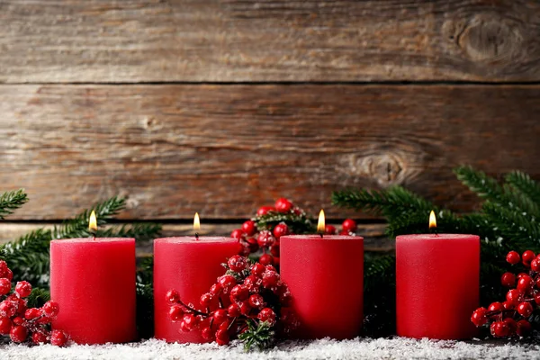Red Christmas Candles Fir Tree Branches Red Berries Wooden Background — Stock Photo, Image
