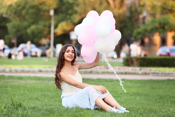 Young Girl Heart Balloons Sitting Green Grass Park — Stock Photo, Image