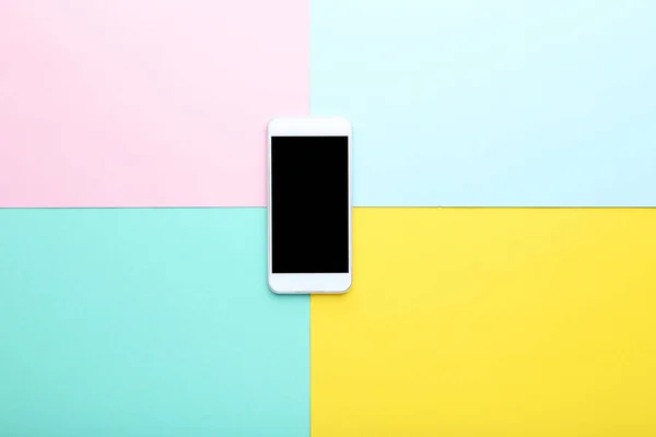 smartphone on blue, pink and yellow background