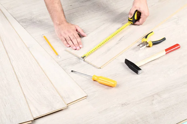 Man Installing Timber Laminate Flooring Tools — Stock Photo, Image