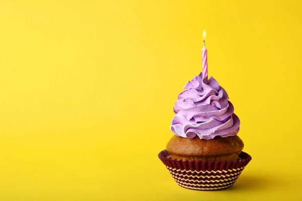 Tasty Cupcake Candle Yellow Background — Stock Photo, Image