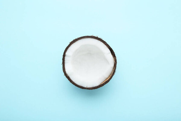 Piece of coconut on blue background