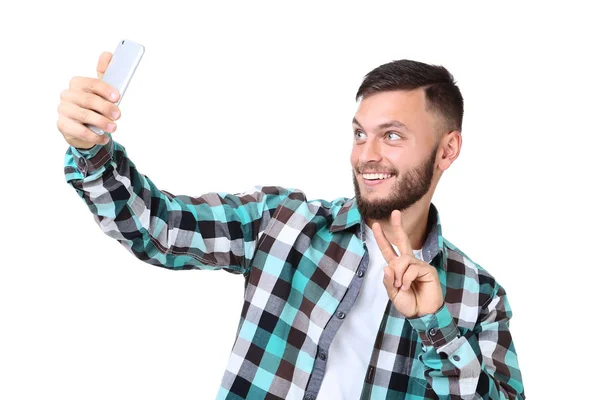Hombre Joven Haciendo Selfie Teléfono Inteligente Sobre Fondo Blanco —  Fotos de Stock