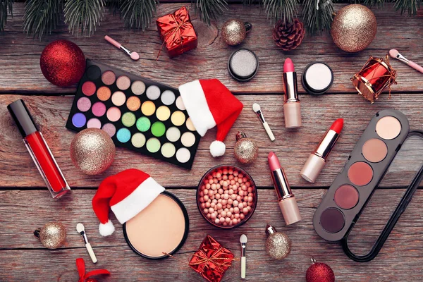 Makeup Cosmetics Christmas Baubles Santa Hat Wooden Table — Stock Photo, Image