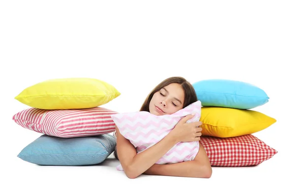 Menina Com Travesseiros Coloridos Deitado Fundo Branco — Fotografia de Stock