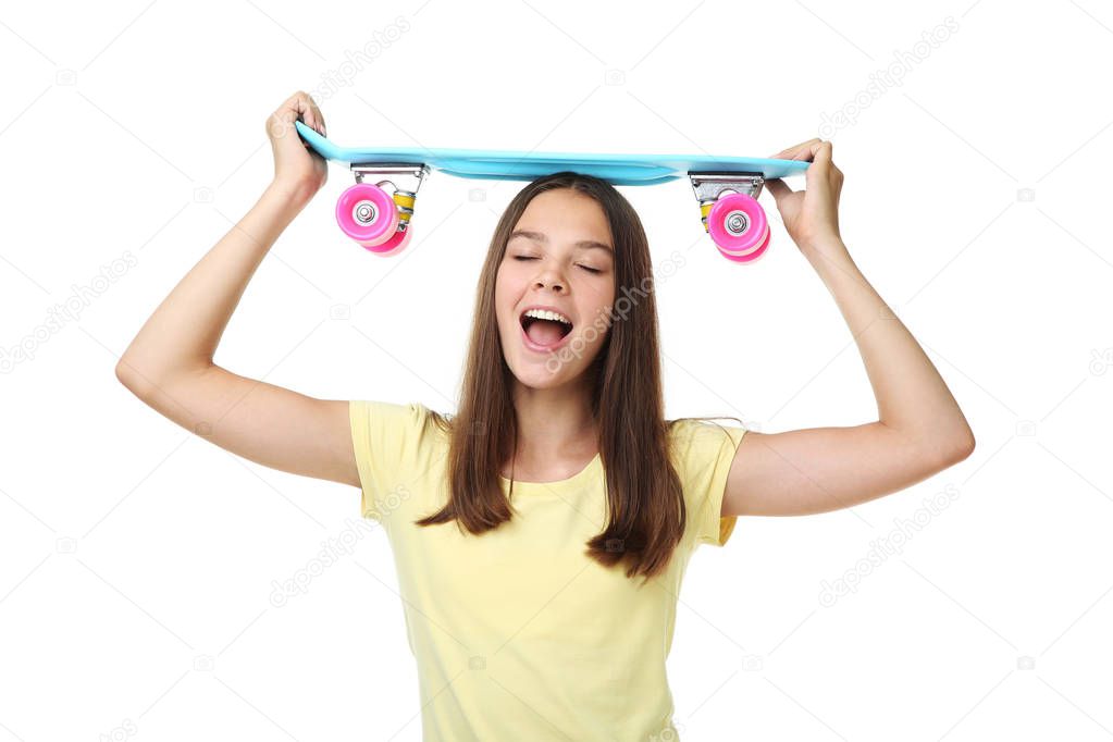 Young girl with skateboard on white background