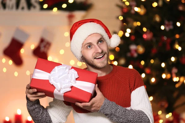 Young Man Santa Hat Gift Box Christmas Tree Home — Stock Photo, Image