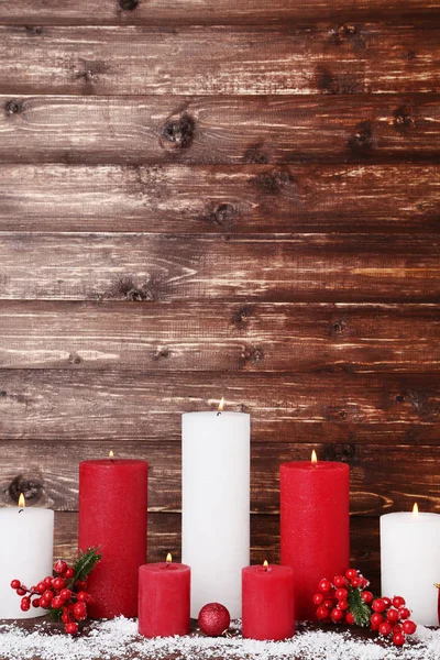 Christmas Candles Red Berries Brown Background — Stock Photo, Image