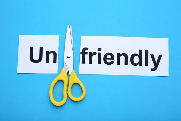 Paper Word Unfriendly Scissors Blue Background — Stock Photo, Image